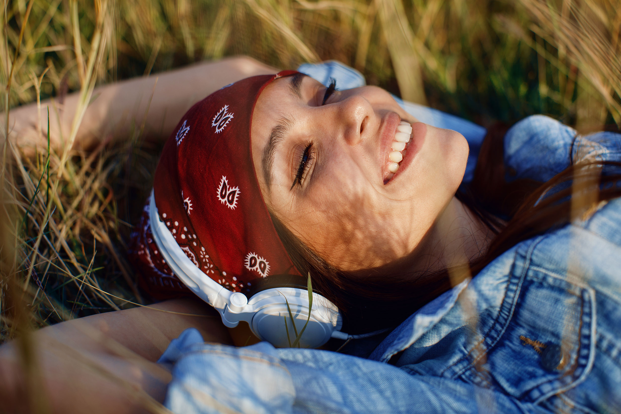 Woman relaxing outside with headphones